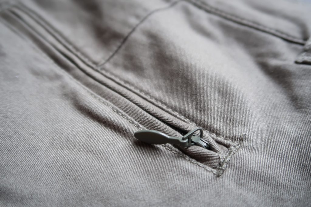 Close up of the back pocket zip on the Flat Front Wrinkle Free Stretch Chino Trousers